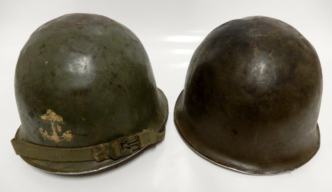 Two post WWII French helmets: Two post WWII French helmets, one marked inside P.N. Pont De Buis R 1969, 6 3/4" x 9 3/4" x 11", other helmet has anchor painted on front, marked inside S.I.A. Le Mans 70 R, measures 7" x 10" x 11"