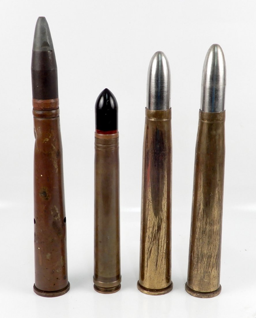 Four large artillery shells: Four large artillery shells, includes dummy cartridge MK 4, two 40MM M25, and P152 1939 6348, measures range 13 1/2" high to 17 1/2" high