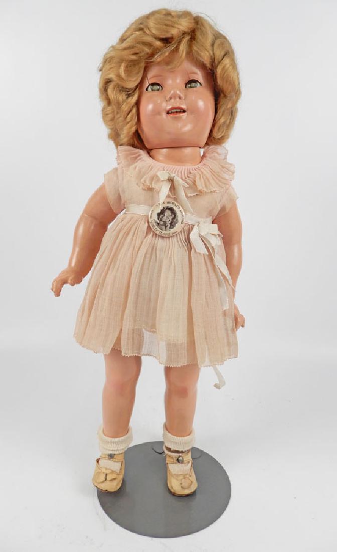 Ideal Shirley Temple composition doll: Ideal Shirley Temple composition doll, jointed composition body, sleep eyes, applied upper lashes, painted lower lashes, eyebrows, open mouth with upper teeth, marked on head "Shirley Temple, Ideal, N