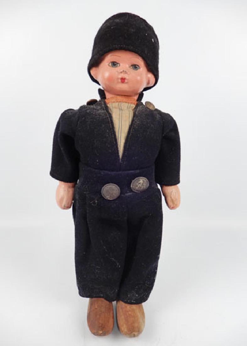 Composition and wood Dutch boy walker doll: Composition and wood Dutch boy walker doll, composition head and arms, wooden shoes, painted features, walking mechanism working, Volendam? doll, clothes sewn on, measures 17" tall