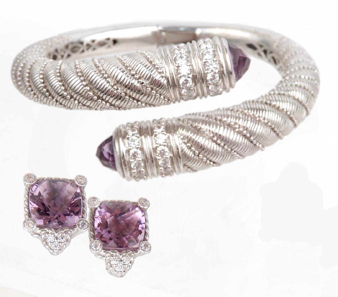Judith Ripka sterling silver torque bracelet earrings: Judith Ripka sterling silver torque bracelet and earrings, twisted silver motif hinged crossover style bracelet with faceted purple stone end caps and CZ accents, interior dimensions 2 1/4" x 2"; Omeg
