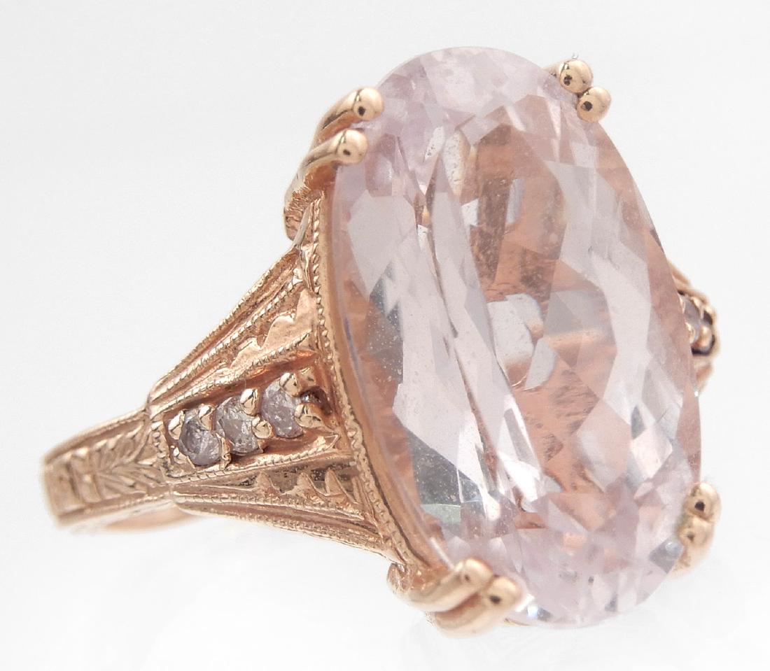 14k rose gold sythenetic lavender stone diamond ring: 14k rose gold synthetic lavender stone diamond ring, oval faceted pale lavender colored stone measuring 16mm x 10mm, diamond accents on sides, size 6, stamped 14k WB, weight 6.2 grams/4.0 dwt
