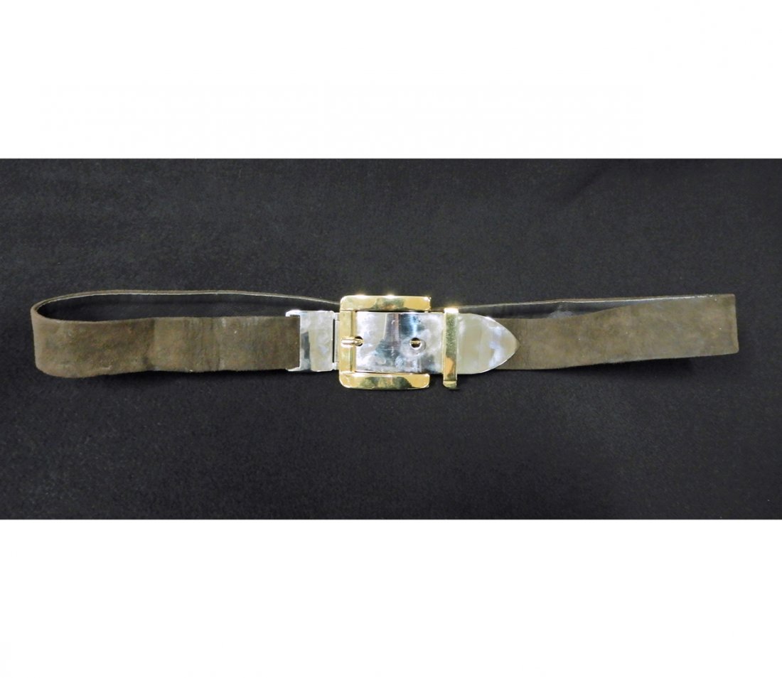 Christian Dior suede belt: Christian Dior suede belt, brown sued belt 1 1/4" wide, 34" long, can be adjusted to a smaller size, two tone buckle measures 5 1/2" x 2 1/4" and is stamped Made in Italy, belt stamped Christian Dior 