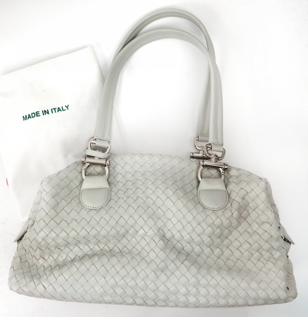 Donald J. Pliner beige leather pocketbook: Donald J. Pliner beige leather pocketbook, woven leather, zip closure, nickel hardware, body measures 20" wide x 8" high x 6" deep, expandable sides, leather covered double handles with 11" drop, zipp