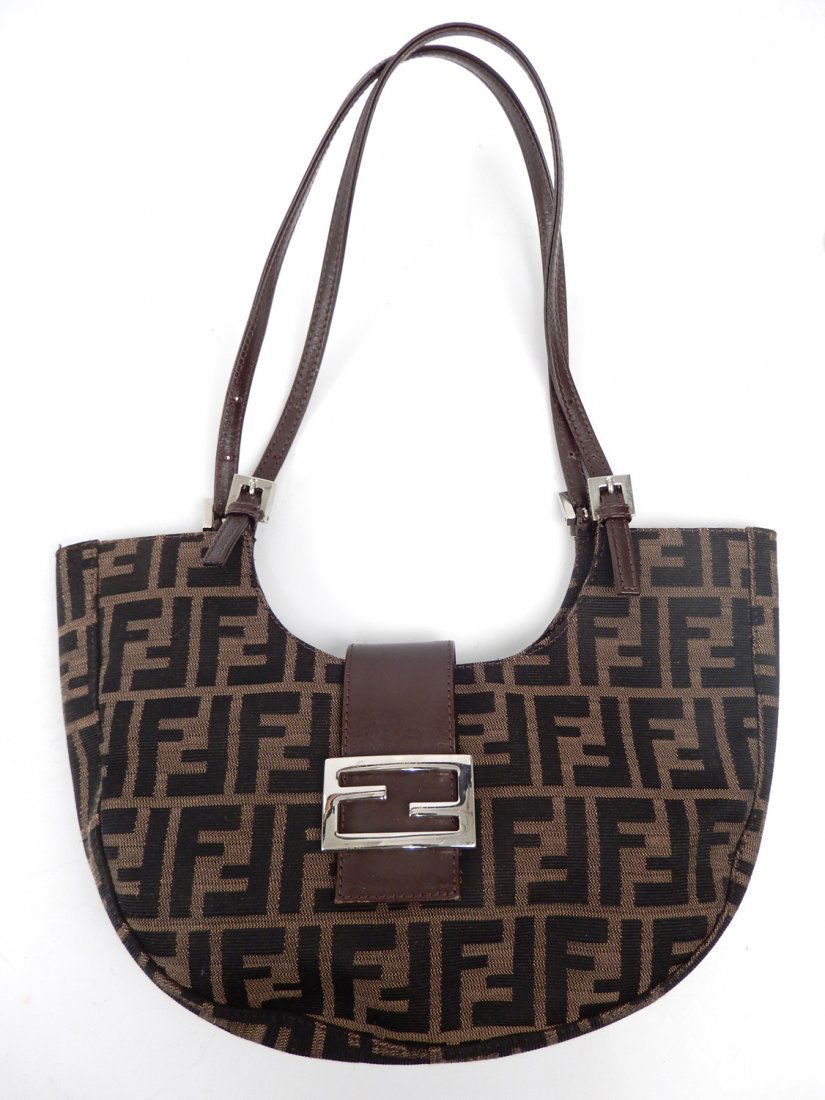 Fendi canvas and leather pocketbook: Fendi canvas and leather pocketbook, logo canvas body with leather closure strap and handles, body measures 13" x 9", handles have 8 1/2" drop, zippered pocket inside