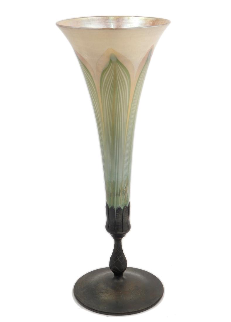 Tiffany bronze and Favrile glass vase: Tiffany bronze and Favrile glass vase, pulled feather glass signed L.C.T. on bottom, bronze stand with artichoke stem and flower form marked Tiffany Studios New York 1043 on bottom, 14 3/4"