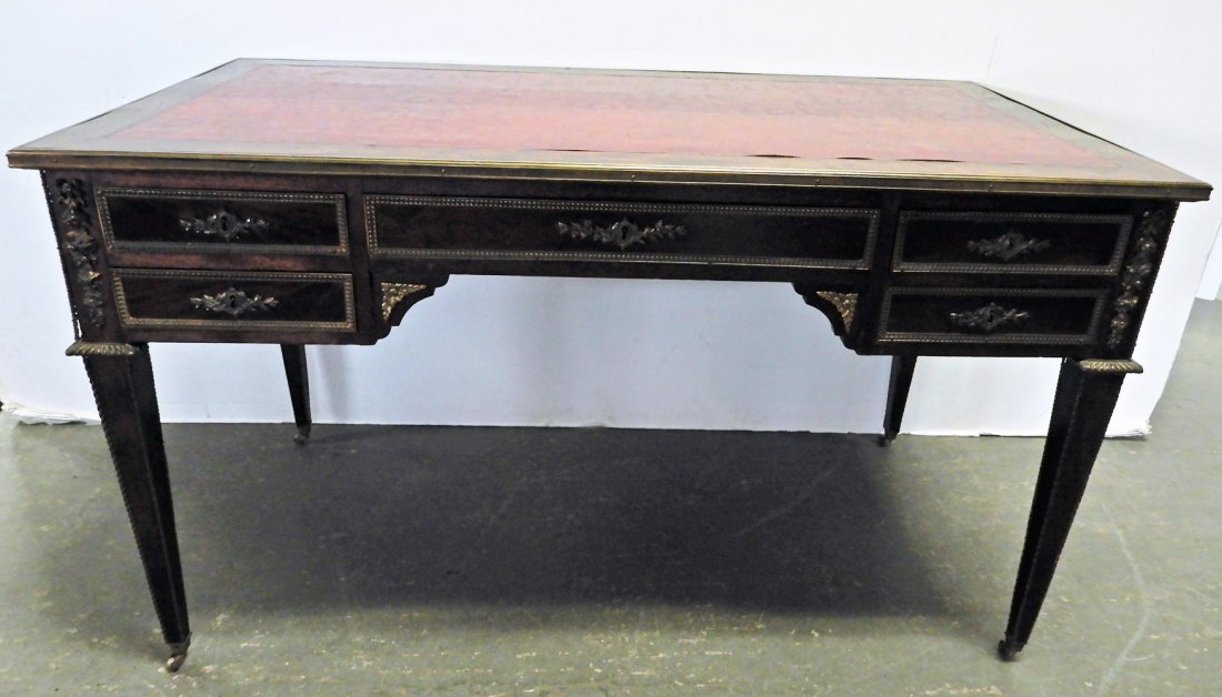 Louis XVI style writing desk: Louis XVI style writing desk, brass ormolu, leather top, faux drawers on one side, on casters, 29 1/2" x 51" x 27 1/2"