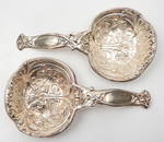 Pair of English sterling silver hand chased serving