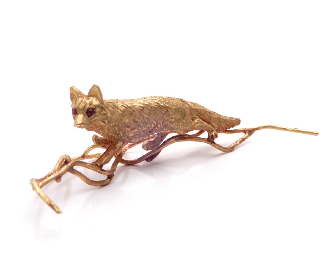 14k gold fox figure: 14k gold fox figure, full figure of fox on branch, red stone eyes, 3" long, unmarked, tests 14k, weight 22.8 grams/14.7 dwt