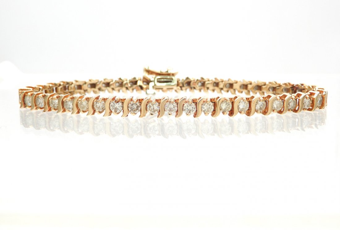 14k gold diamond tennis bracelet: 14k gold diamond tennis bracelet, forty four round diamond measuring approximately 0.10 points each, 4.25 carats TCW, I clarity H color, 7" long x 3/16" wide, stamped 14k, weight 12.0 grams/7.7 dwt