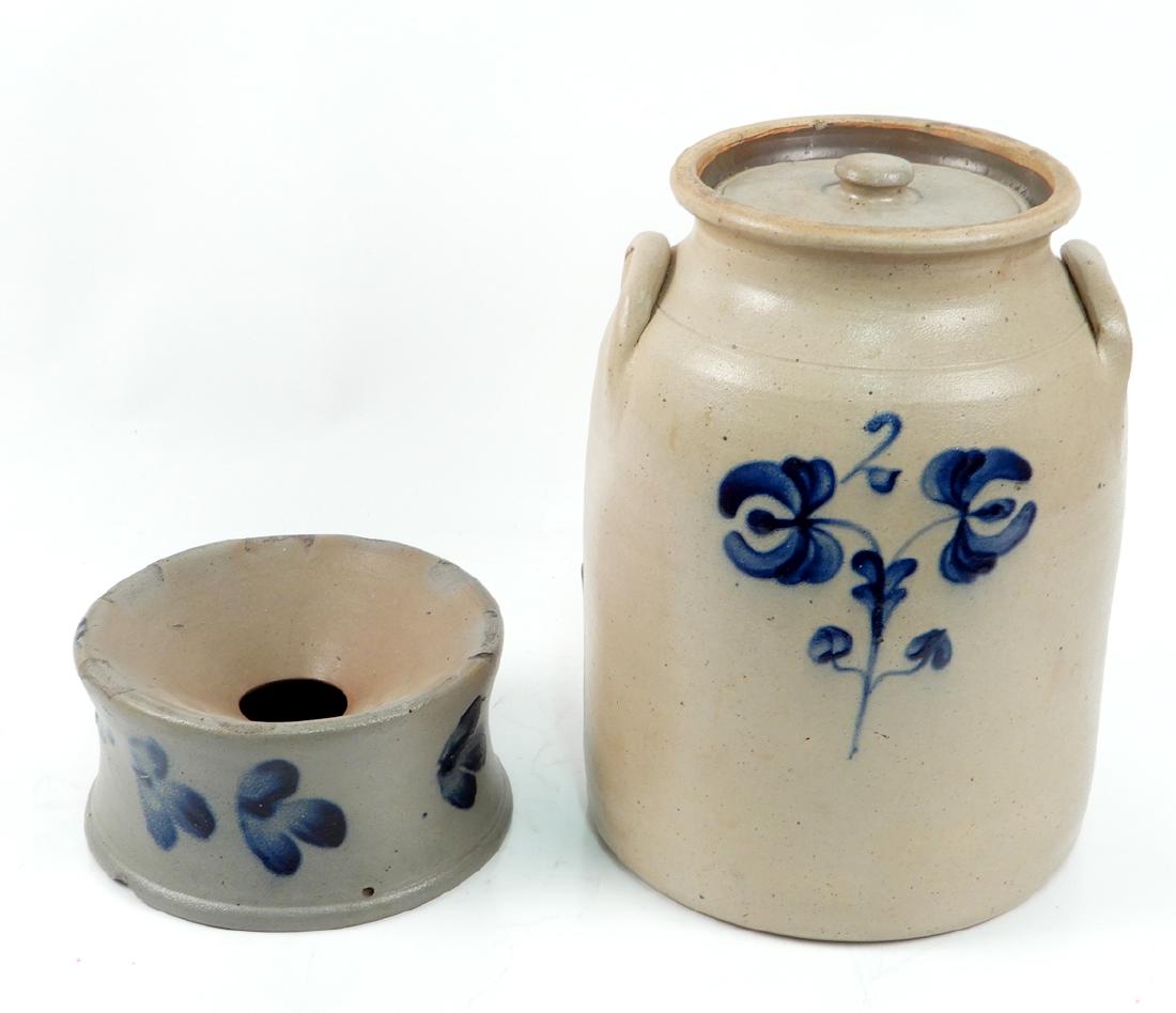 Cobalt decorated stoneware spittoon and crock: Cobalt decorated stoneware spittoon and crock, spittoon measures 4" x 7 1/4" diameter, crock has floral decoration and ear handles, 12" high, with lid