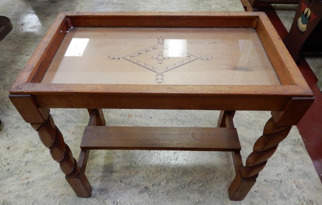 Soft wood table with Native American decoration: Soft wood table with Native American decoration, incised carved design under glass top, 22" x 23" x 13"