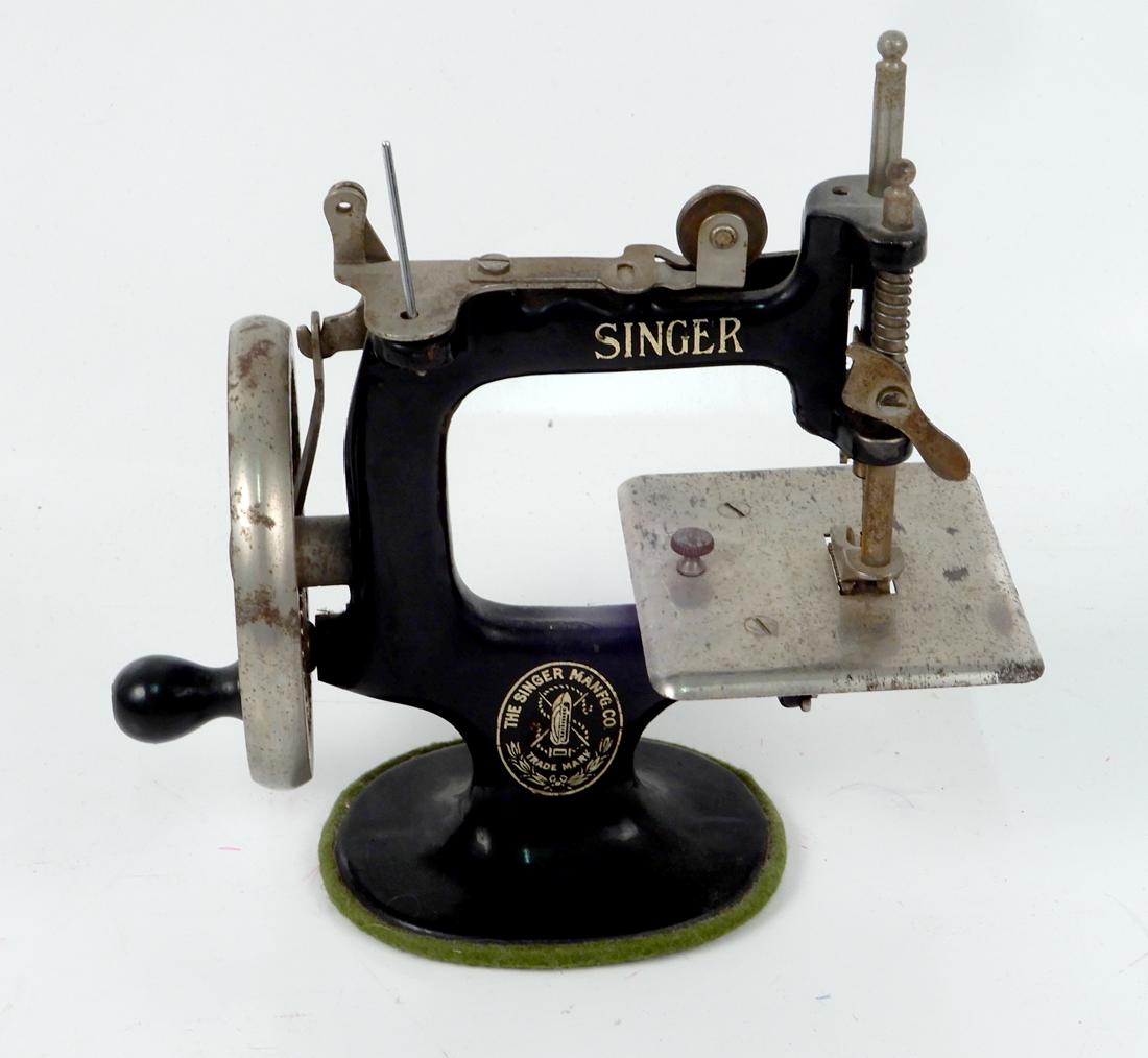 Singer child's sewing machine: Singer child's sewing machine, 7" high, working, 1930's