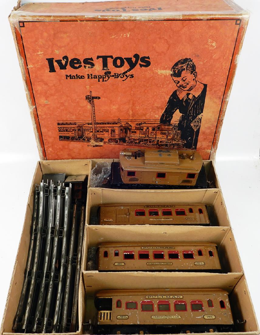 Ives standard gauge passenger train set #692: Ives standard gauge passenger train set #692 in original box with insert dividers, set consists of #3236 tan painted 0-4-0 electric style engine, three tan passenger cars #184 (combine), #185 Pullman