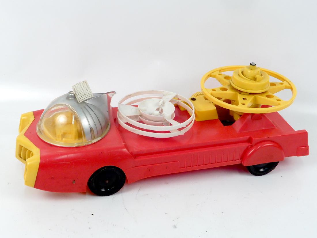 Ideal Toy Corp Jet car with launcher and Remco: Ideal Toy Corp Jet car with launcher and Remco Satellite Launch vehicle, wind-up jet car with launcher in working order, rear tail fins missing from both sides, Remco Satellite launch vehicle mechanis