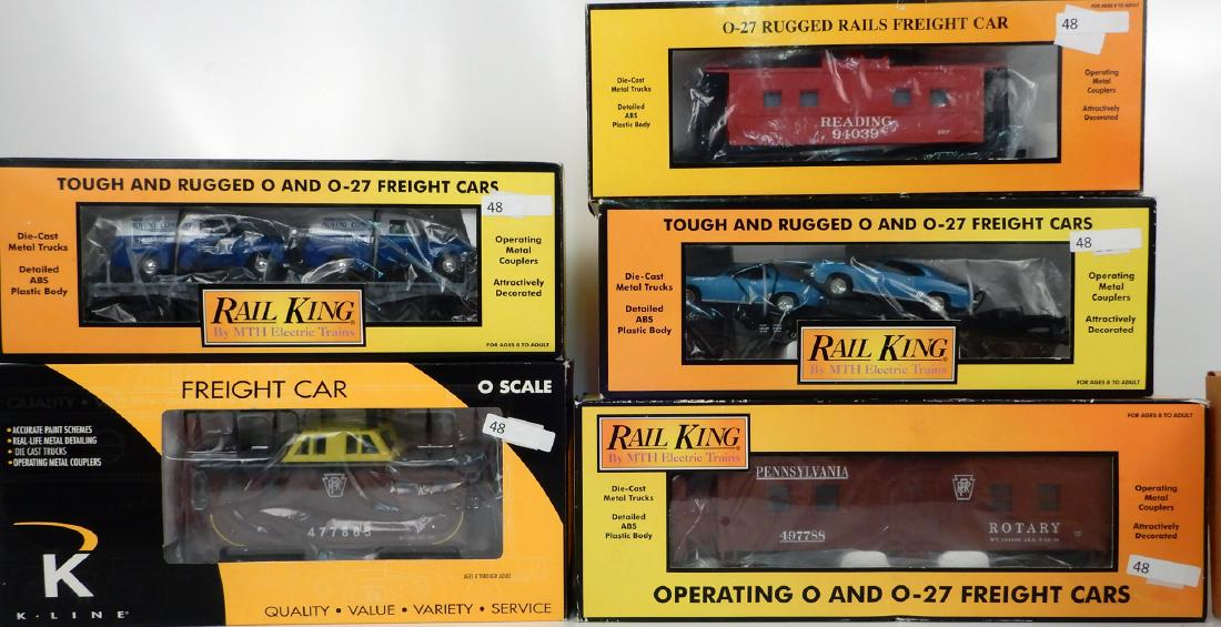 Four MTH Rail King freight cars, K-Line smoking caboose: Four MTH Rail King freight cars, K-Line smoking caboose and Williams Chessie N5C caboose, O gauge, MTH Rail King cars consist of one PRR Rotary snow plow, one Reading steel caboose, one auto transport