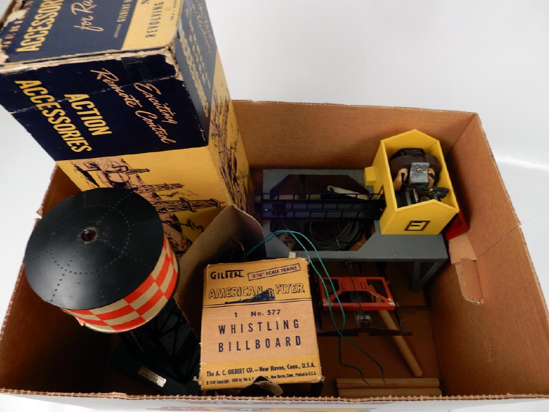 Four American Flyer S gauge accessories: Four American Flyer S gauge accessories, Ringling Brothers whistling billboard with button with original box, #769 Aircraft Beacon with box and insert, #787 Log Loader with logs, #772 checkerboard Wat