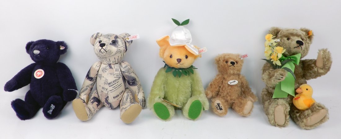 Five Steiff Teddy bears: Five Steiff Teddy bears, all jointed, one musical, largest 14", all with ear buttons and ear tags, two signed on bottom of foot, two with chest tag, bird with chest tag, one with hang tag