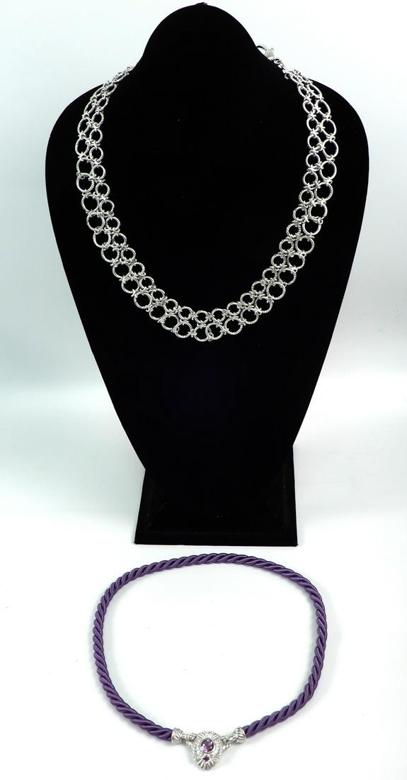 Two Judith Ripka sterling silver necklaces: Two Judith Ripka sterling silver necklaces, one bib necklace comprised of textured links, 17 1/2" long with 2" extender, 1" wide, CZs in clasp, and 20; long purple cord necklace with sterling silver p