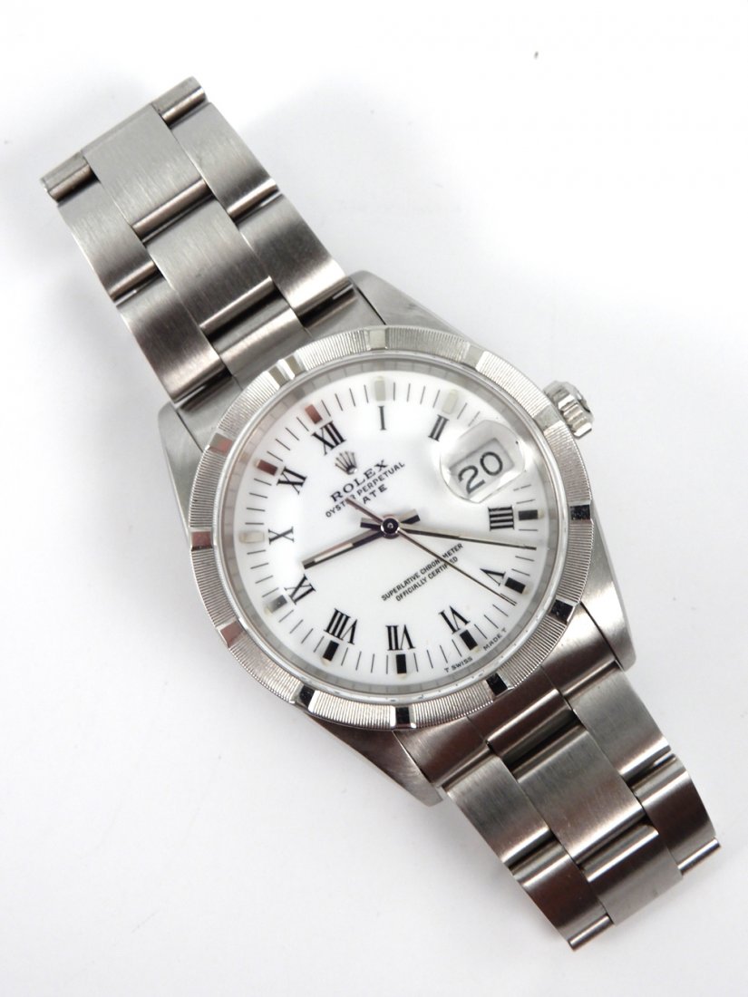 Woman's Rolex wristwatch Datejust Oyster Perpetual: Woman's Rolex wristwatch Datejust Oyster Perpetual, stainless steel case and band, stick Roman numeral dial, 34mm case, 18mm lug, fits 6 1/2" wrist, can be adjusted to slightly smaller size, ca. 1990