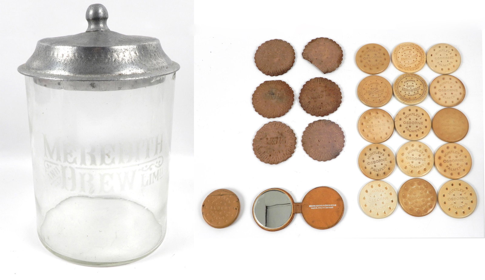 Meredith and Drew Lim'd glass biscuit jar with contents: Meredith and Drew Lim'd glass biscuit jar with contents, aluminum lid on jar, contents include fifteen Huntley Osborne Palmers biscuit form hand mirrors, one Huntley Albert & Palmers tin match safe, l