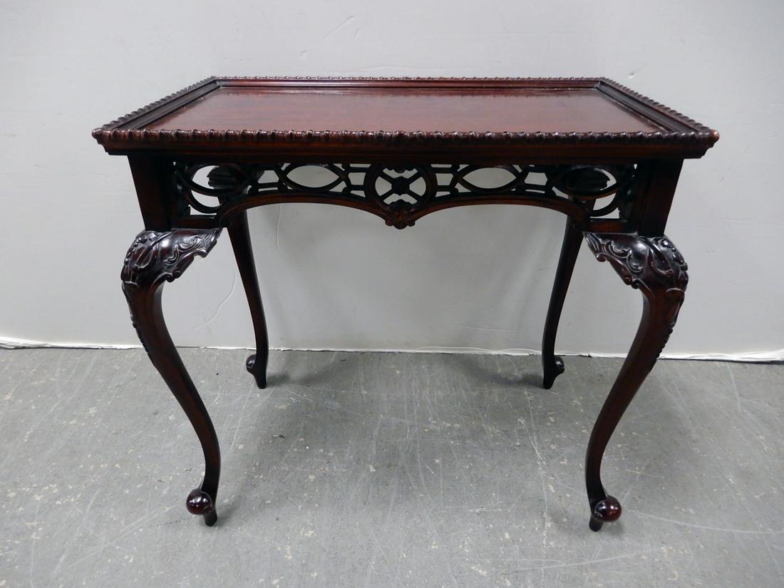 Mahogany tea table: Mahogany tea table, rope twist gallery, pierced apron, cabriole legs, 31 1/2" x 19 1/2" x 32 1/2"