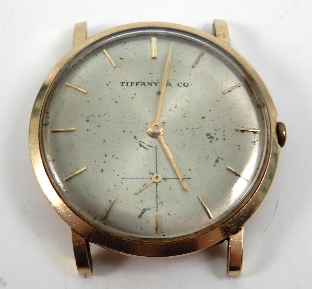 Tiffany & Co. 14k gold men's wristwatch: Tiffany & Co. 14k gold men's wristwatch, 1 1/4" diameter, engraved on back A.S. Joffe in Appreciation CBS Radio 1964, weight 18.0 grams/11.6 dwt