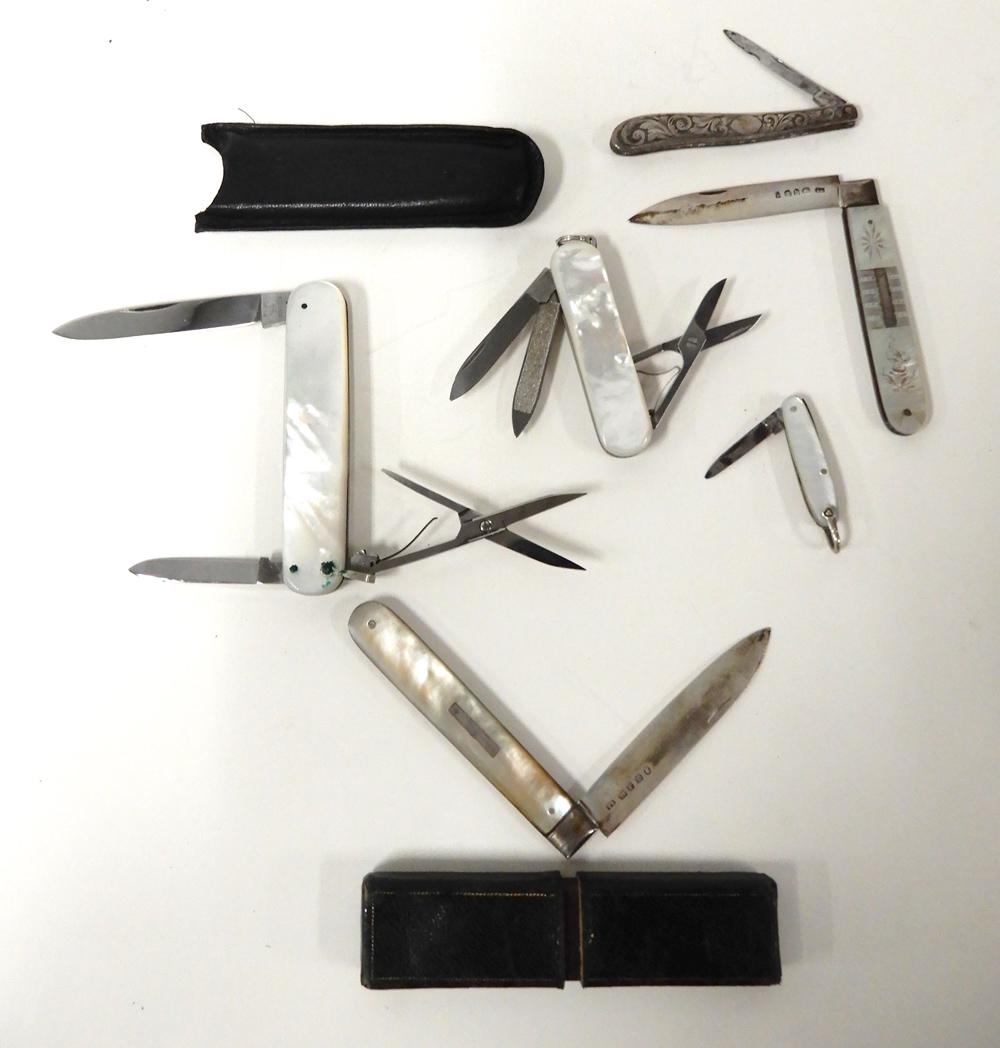 Gentlemen's pocket knives: Gentlemen's pocket knives, 1. Mother of pearl, two blades and scissors from Voss Cut Co. Germany with leather case, 3 1/8"; 2. mother of pearl, one blade, file and scissors from Victorinox Switzerland