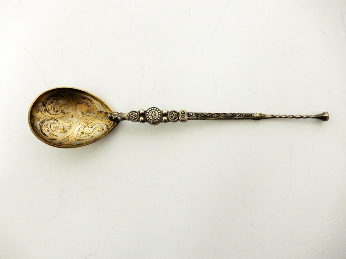 Norwegian .830 silver serving spoon: Norwegian .830 silver serving spoon by Marius Hammer, Bergen Norway, engraved bowl with gold wash design, serpent head at base of engraved and rope twist handle, hallmarked, 1847-1925, 9", 2.065 ozt.