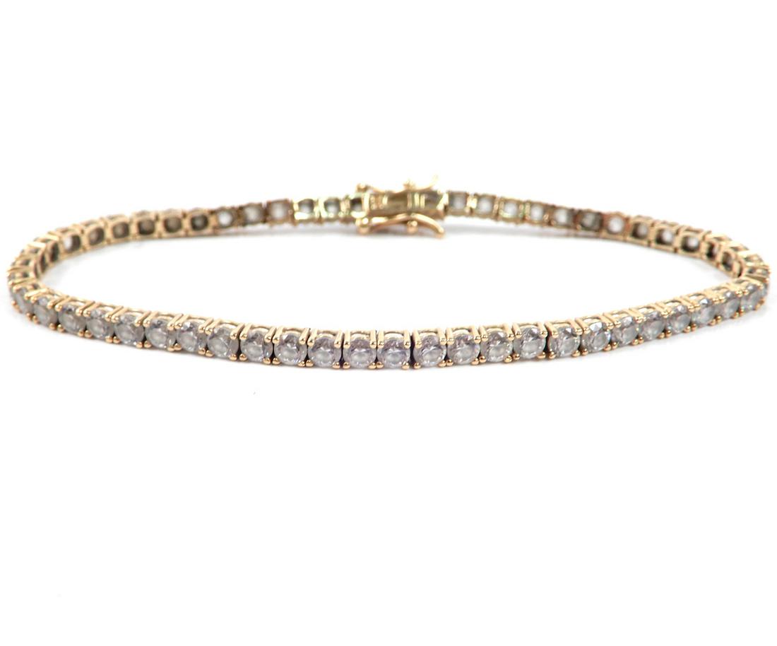 14k gold C.Z. tennis bracelet: 14k gold C.Z. tennis bracelet, 7" long x 3mm wide, stamped 14k, weight 8.2 grams/5.3 dwt