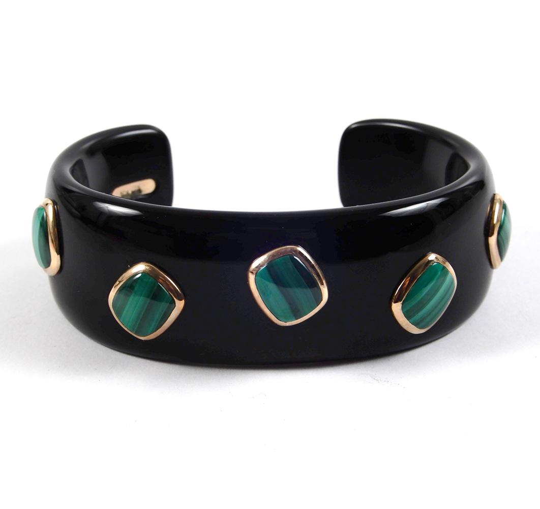 Modern black onyx, malachite and 10k gold cuff bracelet: Modern black onyx, malachite and 10k gold cuff bracelet, 5 3/4" inside circumference with 1" opening, 1" wide, seven rectangular malachite stones in 10k gold bezel settings placed at angles on bracele