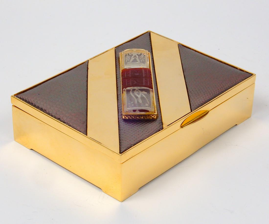 Judith Leiber dresser box: Judith Leiber dresser box, Egyptian Revival motif, gold tone metal and reptile grained faux leather, 5 1/2" x 4" x 1 1/2", lined interior, signed Judith Leiber