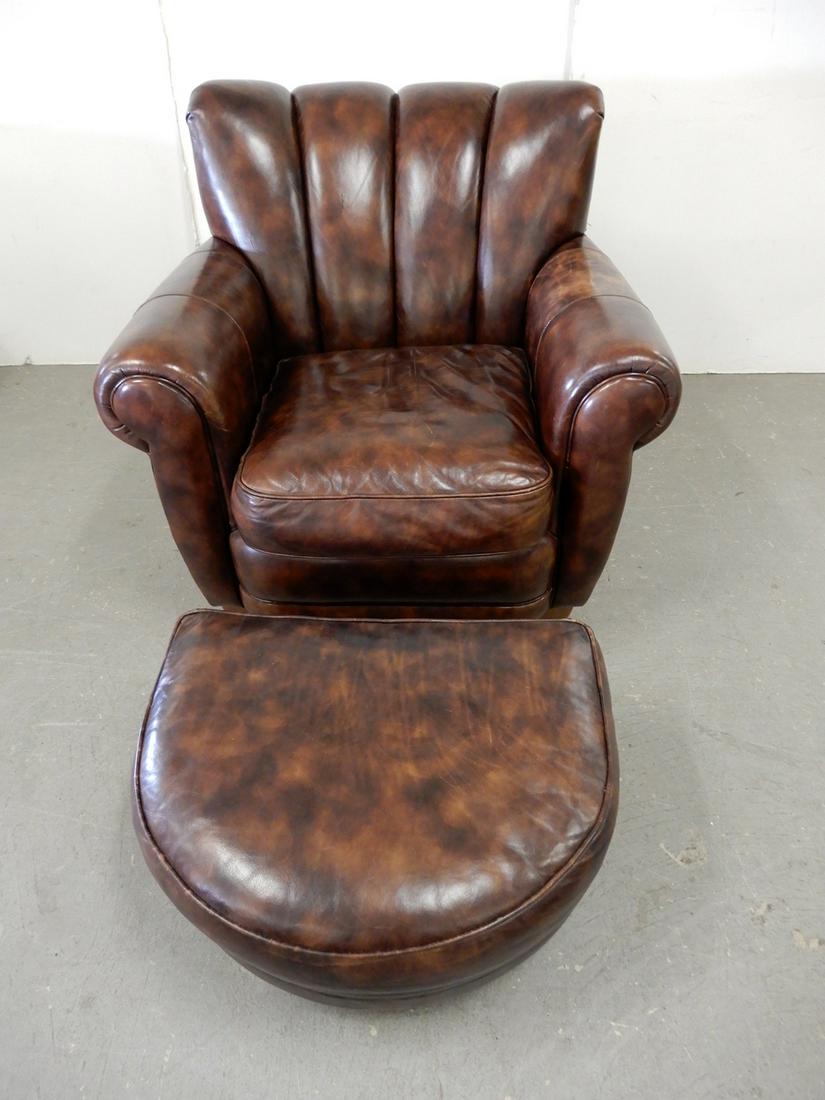 Thomasville distressed leather upholstered club chair: Thomasville distressed leather upholstered club chair and footstool, chair 34" x 37" x 34", footstool 14" x 25" x 21"