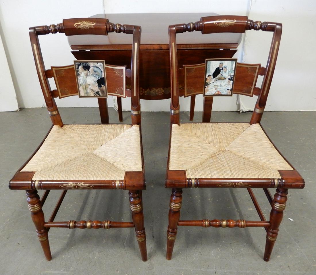 Pair of Hitchcock Norman Rockwell Freedom chairs and a: Pair of Hitchcock Norman Rockwell Freedom chairs and a Hitchcock drop-leaf table, chairs are "Freedom of Worship" Ltd. Edition 33/2000 and "Freedom from Want" 161/2000, 34" x 17 1/2" x 15 1/2", Hitchc