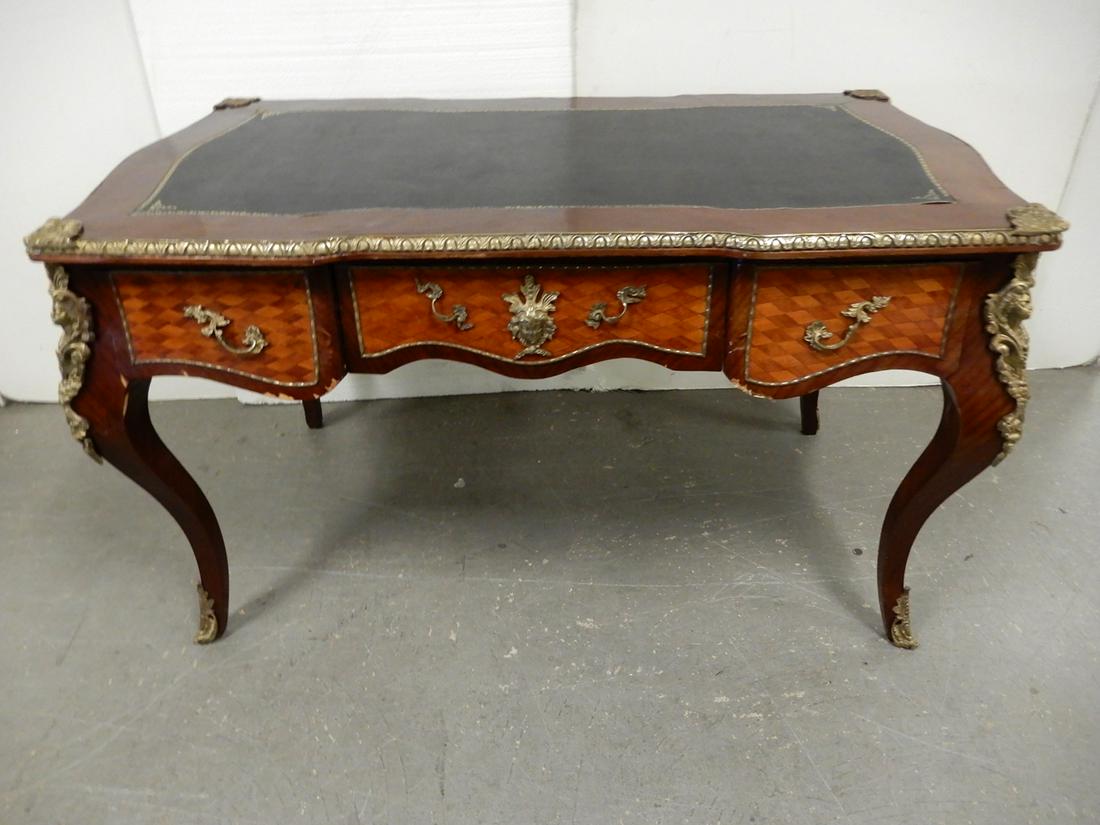 Louis XV style writing desk: Louis XV style writing desk, leather top, marquetry veneer, brass ormolu, three drawers, finished back with ormolu, 33" x 55" x 31"
