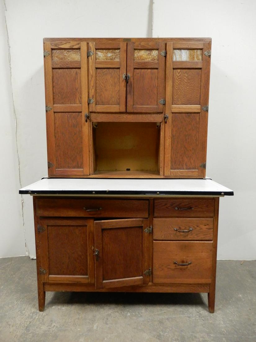 Wilson kitchen cabinet: Wilson kitchen cabinet, oak, with slag glass panels in top cabinet doors, two piece, flour hopper, bread box and original tin shelves, 71" x 48" x 23"