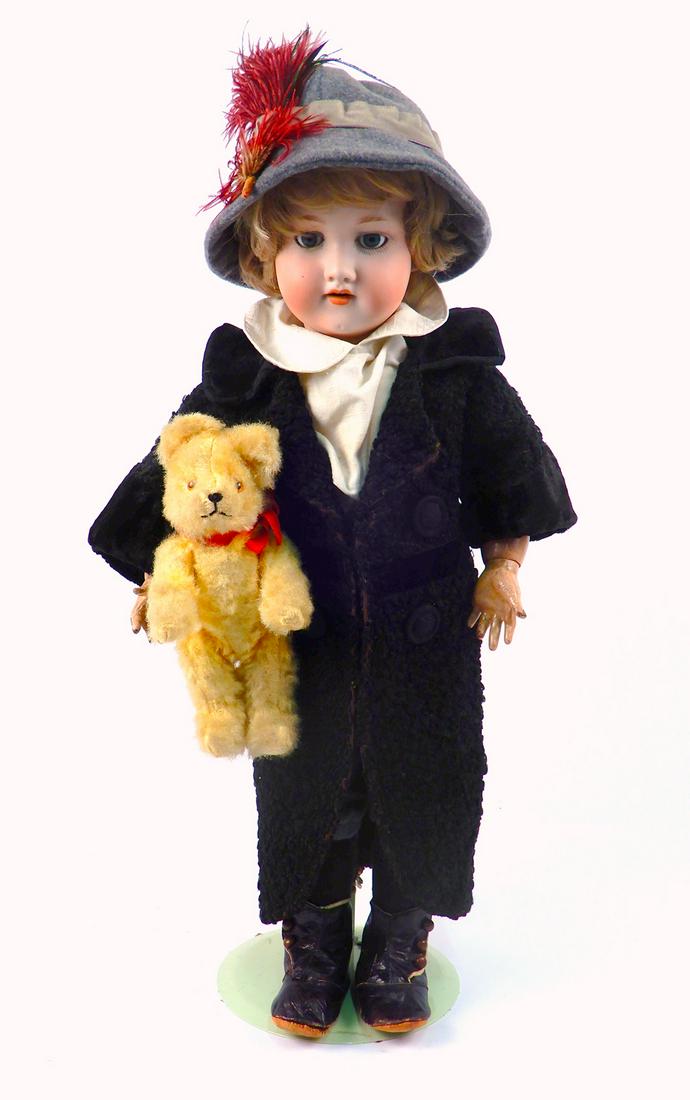 Armand Marseille 390 bisque doll holding a teddy bear (1 of 5)