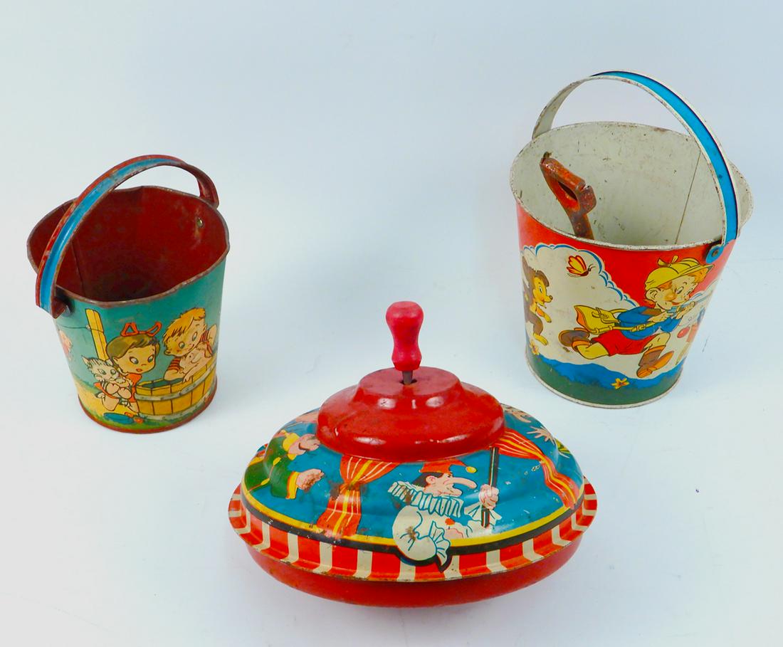 Two small tin litho sand pails and a tin top, 1950's (1 of 2)