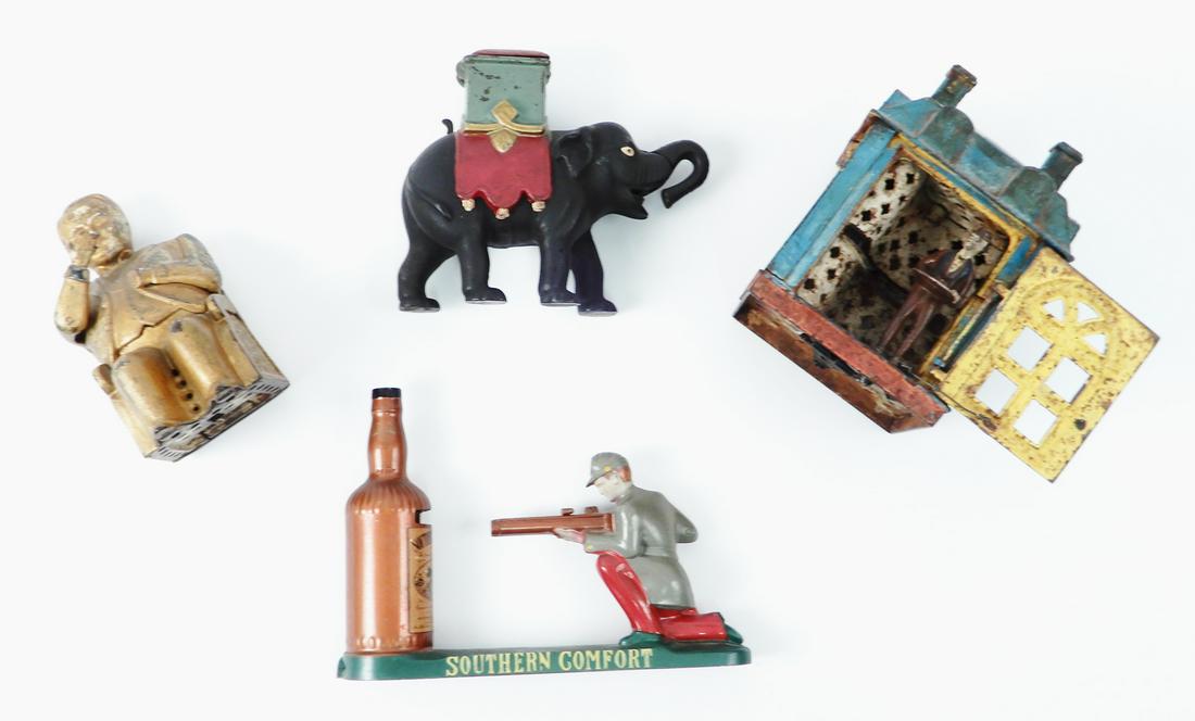 Four cast mechanical banks. (1 of 9)