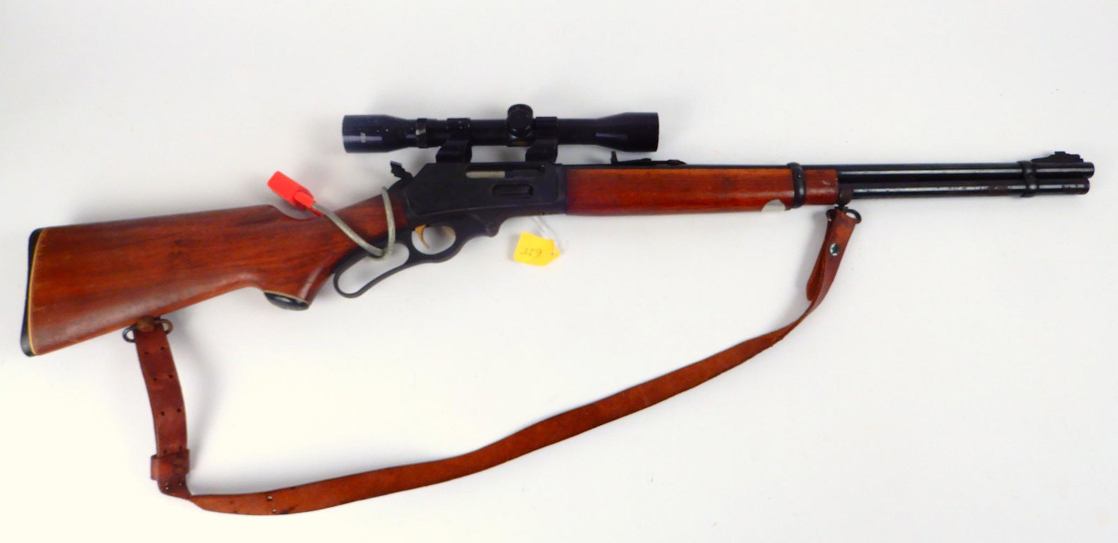 Marlin Model 336 rifle: Marlin Model 336 rifle, lever action (inoperable), open hammer, 30-30 Win., 5 shot, tube feed, No Serial Number, barrel length 20", overall length 38 1/4", open site and Tasco 4 x 32 scope and leather