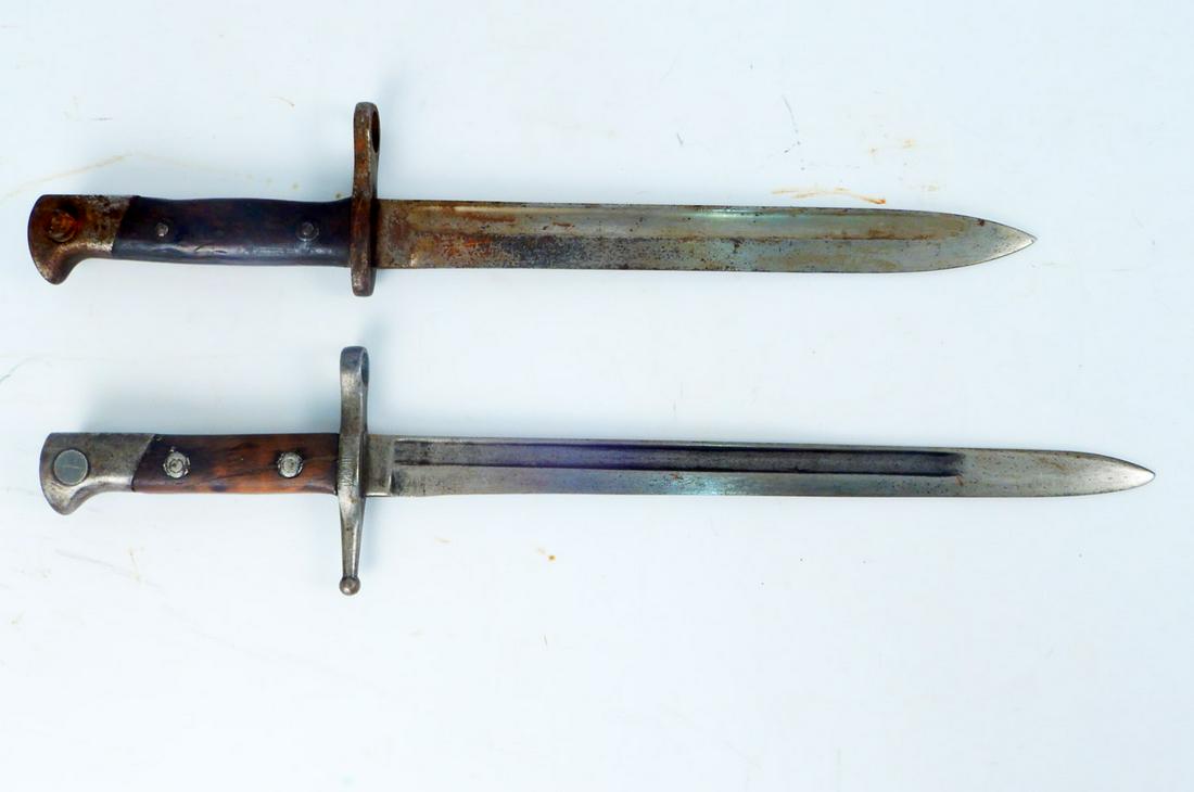 Two WWII bayonets: Two bayonets, WWII Italian bayonet signed C. Gnutti 1941 on side of guard, blade 11 3/8", overall length 15 7/8", and Simpson & Co. WWI bayonet for a Mauser, blade9 7/8", overall 14 3/4"