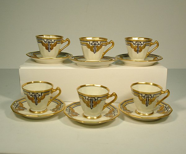 Set of six porcelain demitasse cups and saucers with: Set of six porcelain demitasse cups and saucers with gilt enameled Art Deco geometric and leaf decoration, hand painted, artist signed and dated on bottom, 1934, cups measure 2 1/2" high, 4" saucers, 