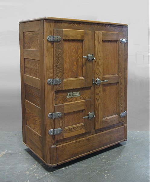 Oak ice box, rectangular overhanging top over thre