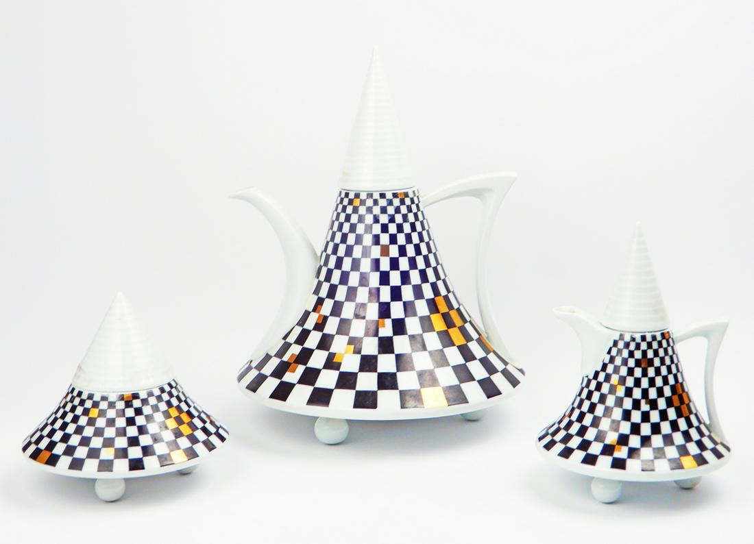 Thun Studio porcelain coffee service: Thun Studio porcelain coffee service, black and gold Obelisk pattern, includes coffee pot with lid, creamer with lid, sugar bowl with lid and (5) footed cups