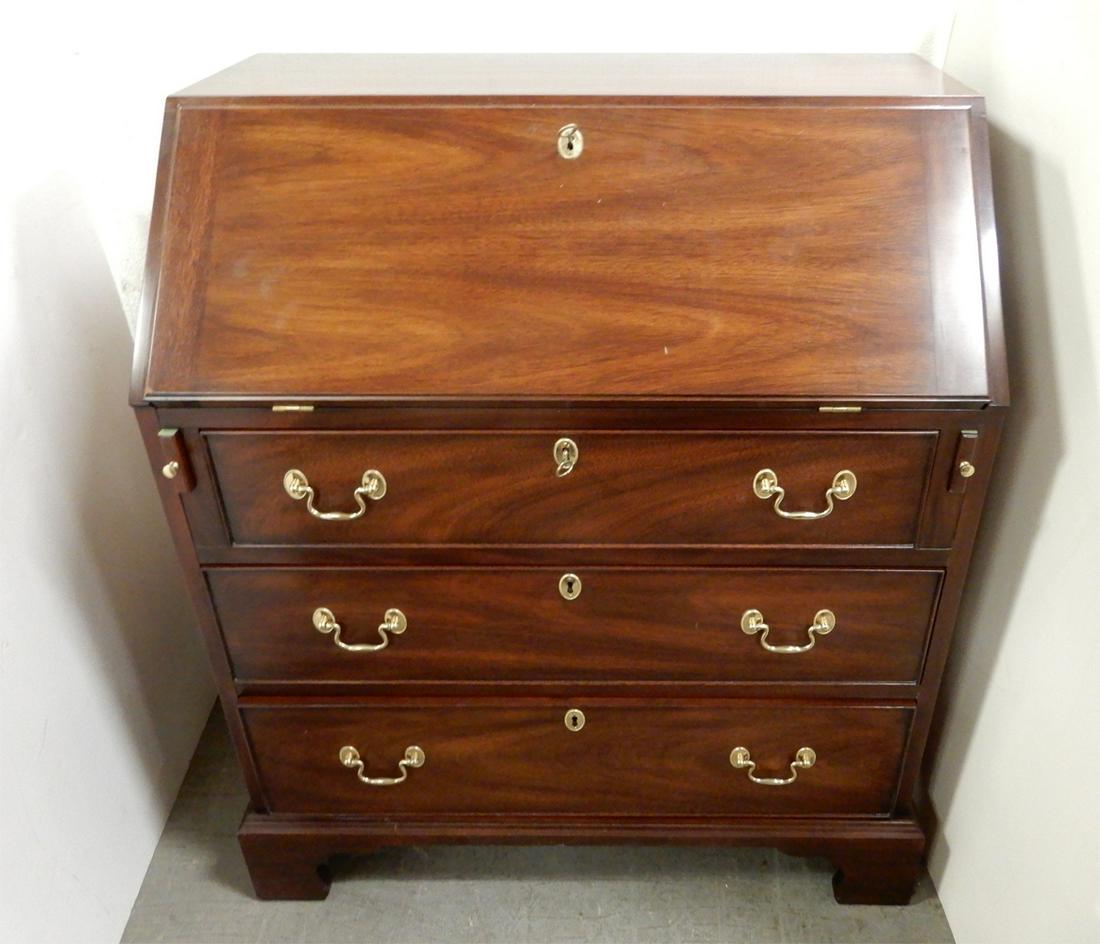 Henkel Harris mahogany slant front desk: Henkel Harris mahogany three drawer slant front desk, Henkel Harris mark on inside of top drawer, 36 1/2" (height) x 32 (length) x 18" (width)