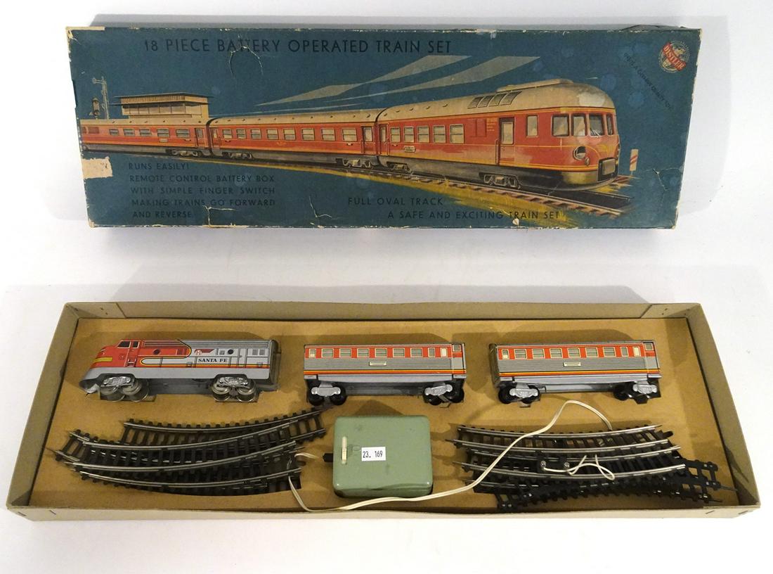 1960's Distler (West Germany) tin litho battery: 1960's Distler (West Germany) tin litho battery operated HO train set in original box. Set is in Santa Fe passenger train colors. Set consists of a diesel engine, two silver and red passenger cars, tr