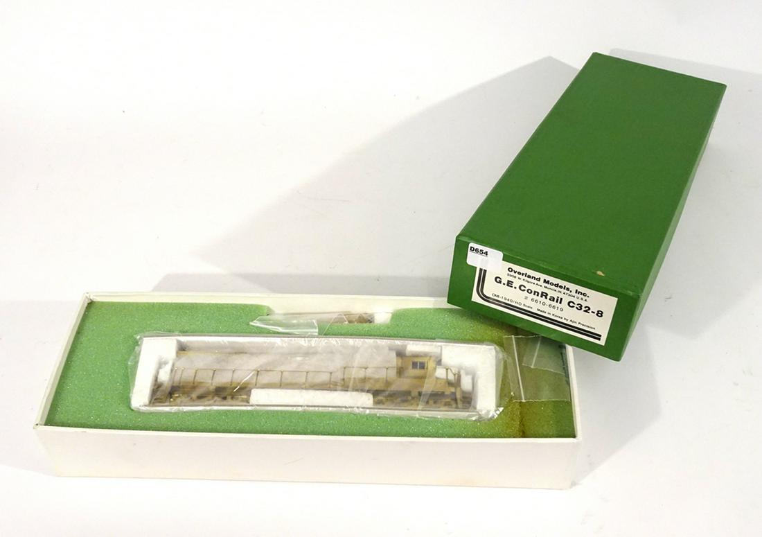 1990's Overland Models brass GE Conrail C32-8 HO gauge: 1990's Overland Models brass GE Conrail C32-8 HO gauge diesel in original box. Approx. 9" long. Diesel is made by Ajin Precision Models (Korea). Still sealed in original wrapper. Original box has inse