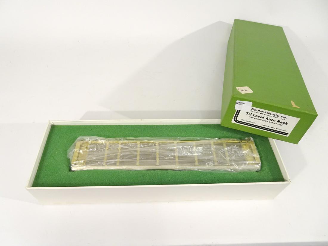1990's Overland Models brass HO gauge Tri-level Auto: 1990's Overland Models brass HO gauge Tri-level Auto Rack Transport in original box. This auto transport has closed sides and roof. Made by Ajin Precision Models (Korea). Still wrapped in original pla