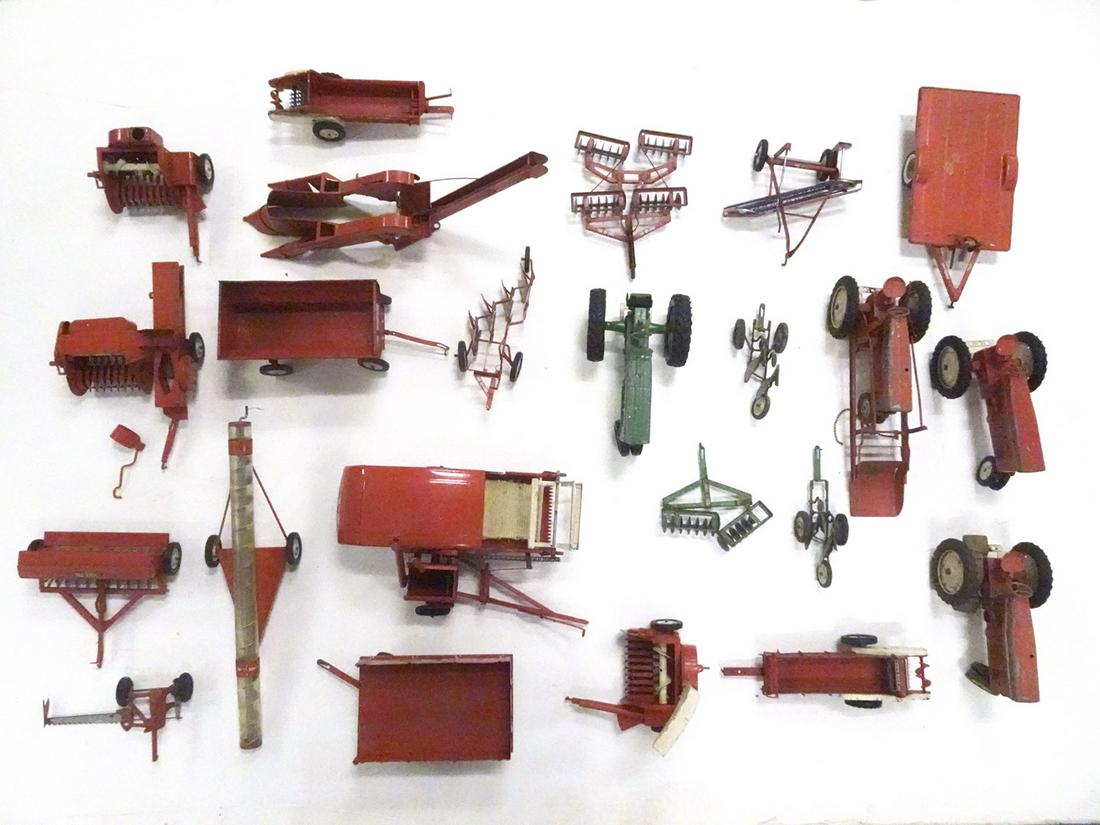 A large lot of 1950's-1960's Tru-Scale farm tractors: A large lot of 1950's-1960's Tru-Scale farm tractors and implements--20 plus pieces. A very played with farm toy lot. Most in red but some pieces in green paint. Most of the wheel hubs are metal. Some