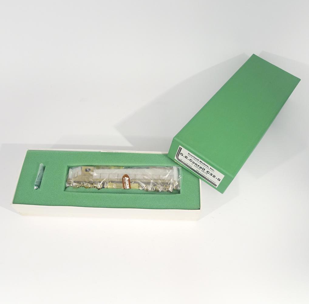 Early 2000's Overland Models by Ajin Precision (Korea): Early 2000's Overland Models by Ajin Precision (Korea) unpainted brass G.E. Conrail C32-8 diesel engine. Engine measures 9" long. original box has inserts.